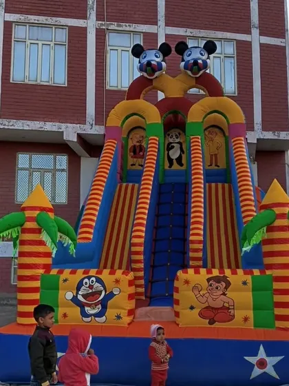 This is a popular 3-lane bouncy slide with Chhota Bheem and Doraemon characters. It's great for parties with lots of kids so no one has to wait long for their turn.