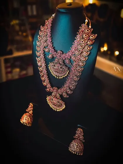 A glimpse of my collection on display. This ruby-colored temple jewellery set is a favorite among many brides.