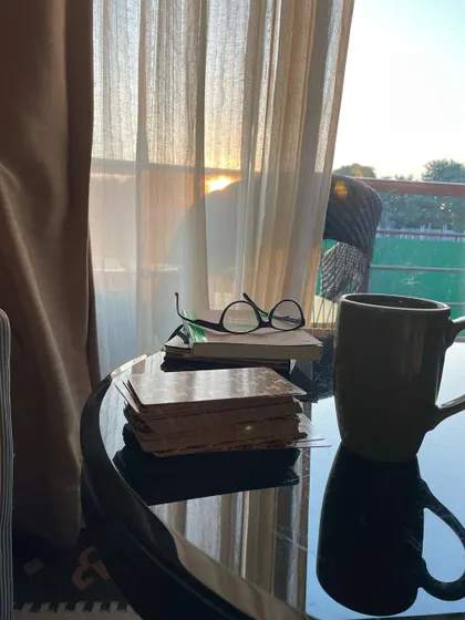 My favorite things all in one picture: a cup of chai, my books, my tarot cards, and a beautiful sunset. These are the simple joys that fill my cup and recharge my spirit.