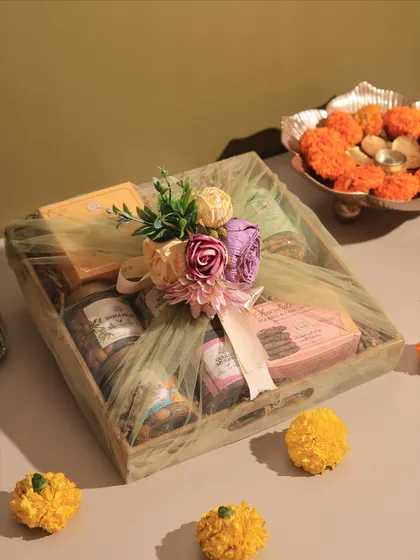 A closer look at our Gourmet Tray Hamper, wrapped and ready for gifting. The combination of our eggless treats and the reusable wooden tray makes it a practical and delicious present.