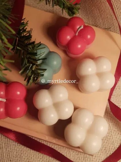 A top-down view of our Christmas Bubble Candles. Their geometric shape and festive colors make them a unique decorative piece for any modern holiday display.