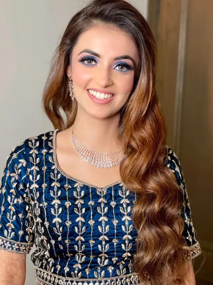 A close-up on that gorgeous smile. The makeup is blended perfectly to look stunning in photos.