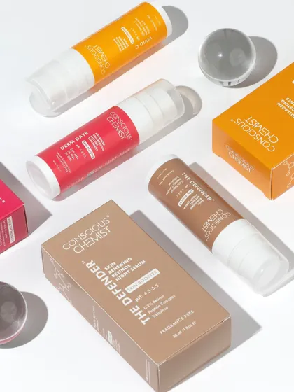 We love a clean, organized flatlay. This shot uses hard light to create crisp shadows, showcasing the brand's range of serums and packaging in a way that feels both scientific and aesthetically pleasing.