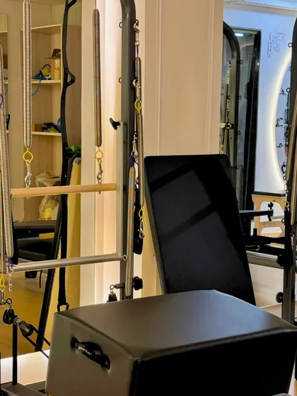 A look at the Cadillac and reformer setup in our GK-1 studio. This is where you'll build strength and grace.