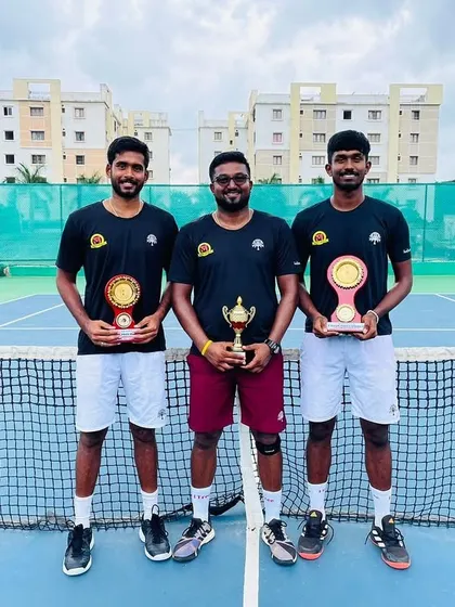 Coach celebrating with singles winner Oges and runner-up Sivadeep in Hyderabad.