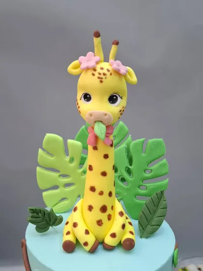 A close-up of the tall, elegant giraffe figurine.