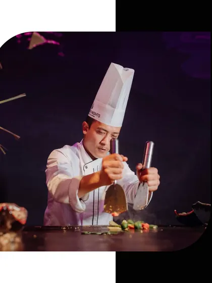 With precision and passion, our chefs elevate dining to an art form. Here, a chef at a live teppanyaki station creates dishes that are as exciting to watch as they are to eat.