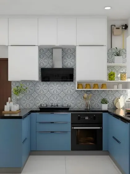 I love the patterned backsplash in this U-shaped kitchen. It adds so much personality and pairs beautifully with the blue and white cabinets. The integrated oven is a great space-saver.