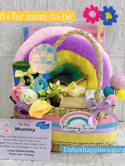 This shot displays the full "Gifts for mom-to-be" rainbow hamper, complete with a sweet personalized message card, making it a ready-to-give present.