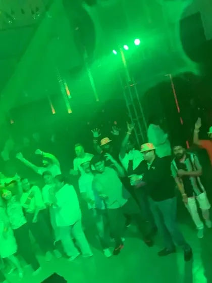 The green lights and smoke machine created a classic club atmosphere.