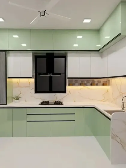 We offer a variety of color options for our modular kitchens. This render shows a lovely pastel green and white combination, perfect for a fresh and modern home.