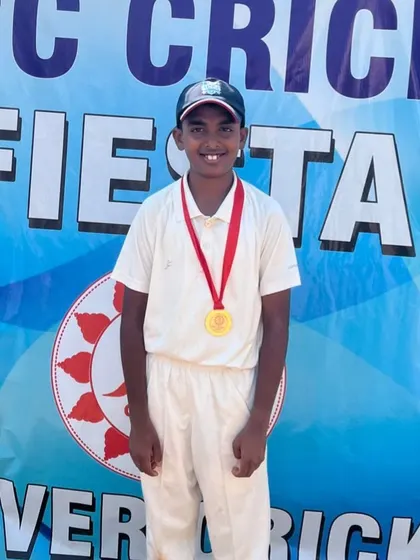 Aniruddh M posing with his medal.