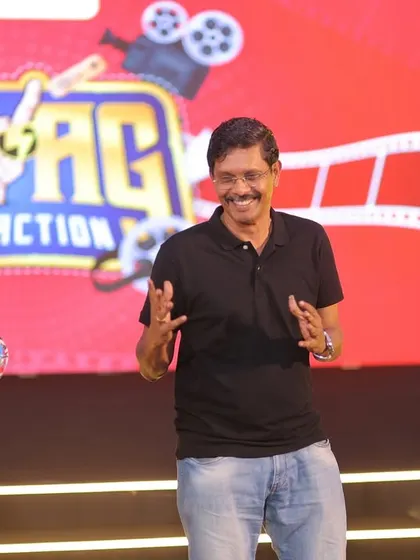 Sharing a laugh with a participant on stage at the Apraava event. Creating genuine, unscripted moments is what makes an event memorable.