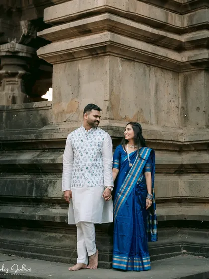 A classic pose against a historic backdrop. This image from Ankush and Aishwarya's pre-wedding shoot feels both timeless and personal.