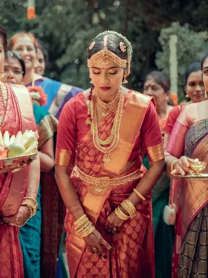 A beautiful shot of a bride's procession, surrounded by her family, capturing the community and tradition of the ceremony.