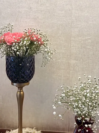 Another look at the delicate beauty of pink carnations and baby's breath. I use high-quality glass and brass vases to complement the floral arrangements and add a touch of sophistication.