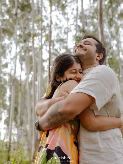 A big, heartfelt hug in the middle of the woods. You can feel the warmth and love.