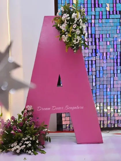 A custom floral monogram prop. This large letter 'A' decorated with flowers was a beautiful statement piece for a fairy-themed party.