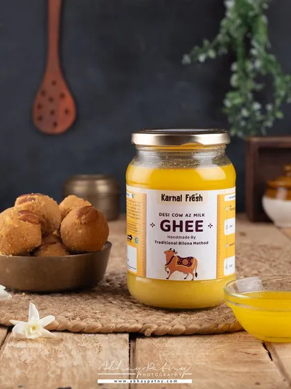 Here, the composition is designed to build trust. The traditional props and simple, honest presentation of the desi ghee reinforce the brand's message of purity and natural methods.