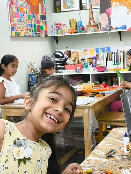 The joy of art class! This student's bright smile says it all. Our studio is a place where kids can be themselves, have fun, and let their creativity shine.