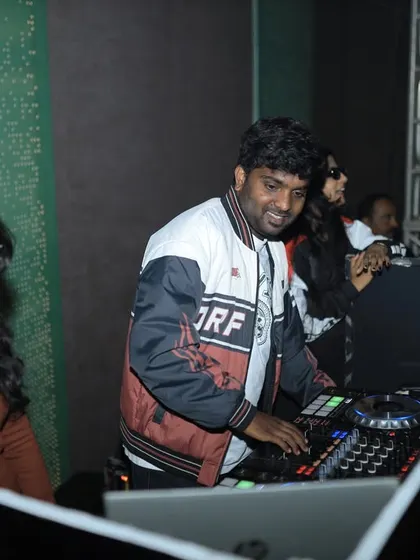 Sharing a laugh behind the decks. A good party is a team effort, and I love the collaborative energy of live events.