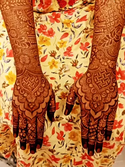 Another example of a mature henna stain on the back of the hands. The intricate patterns are clear and the color is rich.
