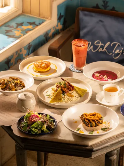 A beautiful spread of dishes at the Taj Mahal Tea House, showing a full meal experience.
