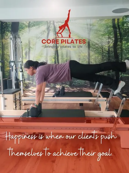 Happiness is when our clients push themselves. This client holds a challenging plank with leg lift on the Reformer, showcasing her progress and strength.