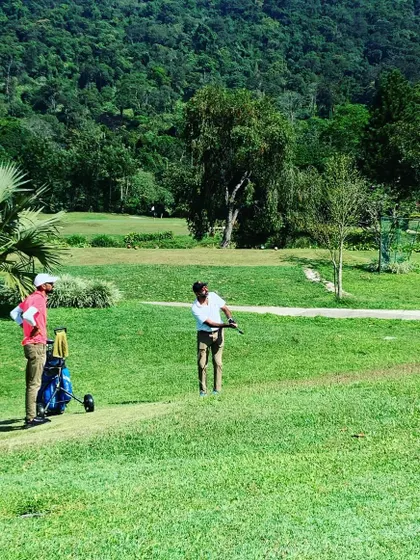 On the course with Rohan Bopanna, watching him execute a swing against the beautiful backdrop of the Coorg Golf Links.