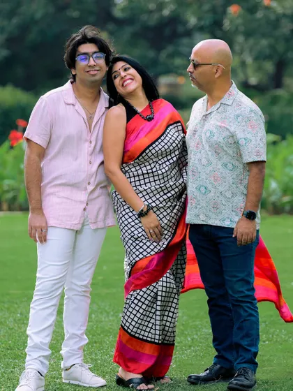 A candid moment of affection between a mother and her son, with the father looking on. I watch for these unscripted interactions that tell the real story of a family.