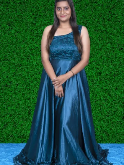 A one-shoulder gown in a beautiful shade of teal satin. The simple, elegant design is perfect for a minimalist and modern aesthetic.