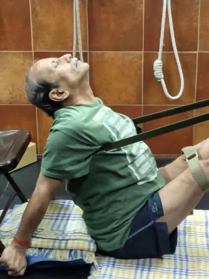 A seated core-strengthening pose using a chair and straps, from a recent online workshop. My virtual classes maintain the same focus on precision as my in-person sessions.