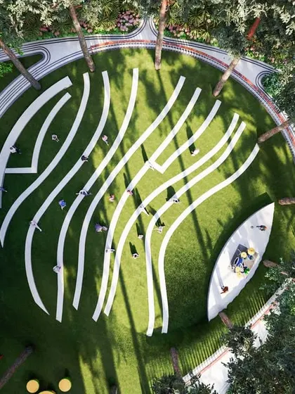 An aerial view of a sculptural lawn with flowing white lines, designed as a large-scale piece of land art for passive recreation and visual enjoyment.