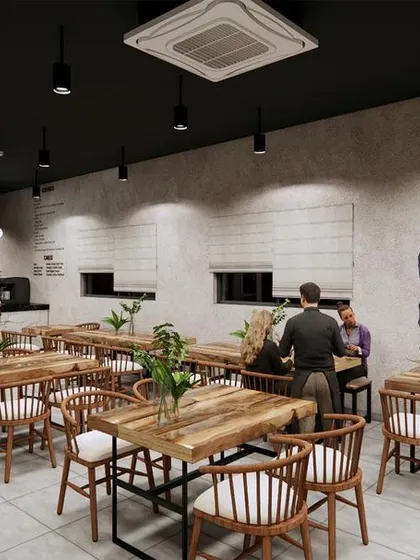 This view of the cafe concept shows how I incorporate custom art, like the wall mural, to give a space a unique personality. The layout is designed to maximize seating while maintaining a comfortable flow.