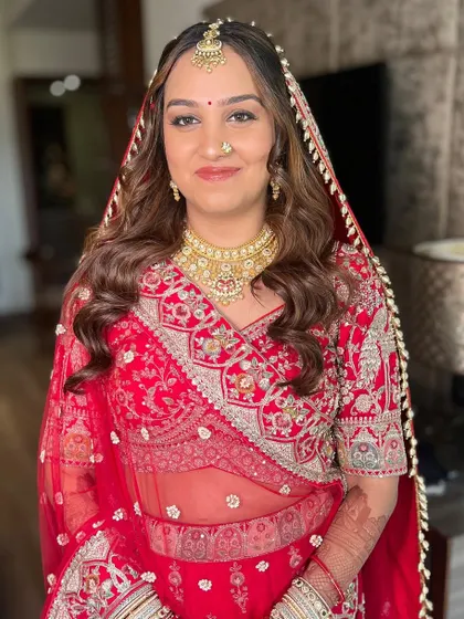 A beautiful portrait of Mrunali. Her unfiltered makeup looks fresh and timeless, proving that you don't need heavy layers to be a stunning bride.