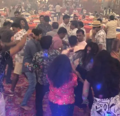 A full view of the dance floor at the Hawaiian-themed corporate banquet.