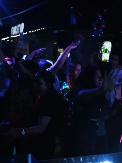 The dance floor under the blue and purple lights. It's all about creating that perfect club atmosphere where people can escape and enjoy the music.
