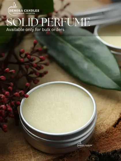 A round tin version of my solid perfume, showing that I can source different packaging options to fit your brand's needs.