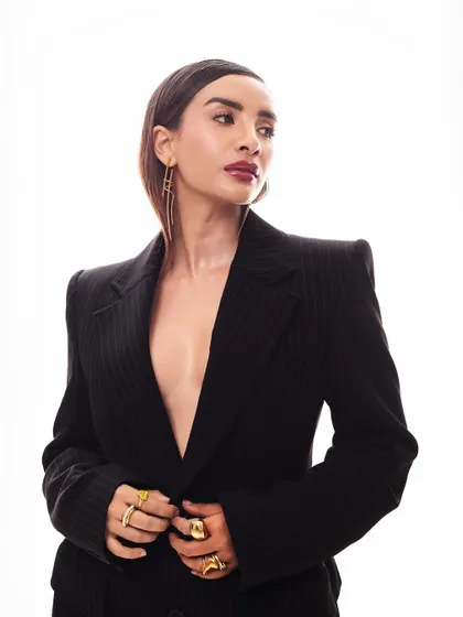 A profile shot that emphasizes the sharp, structured shoulders of the Balenciaga blazer. It’s a look that means business.