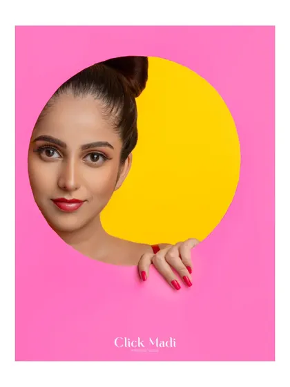 Clean, graphic, and full of personality. This shot uses a simple circular cutout to create a strong focal point, letting the model's expression and the vibrant color palette do all the talking. It’s a great style for influencers and brands wanting a fresh, modern aesthetic.