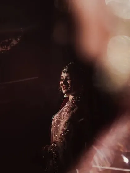 Another take from my experimental series, this image uses deep shadows and a single point of light to create a mysterious and artistic bridal portrait. The focus is on the silhouette and the hint of a smile in the darkness.
