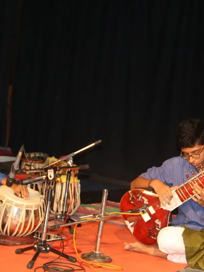A young sitar player and tabla player performing together. Understanding the relationship between melody (raag) and rhythm (taal) is fundamental to Hindustani music.