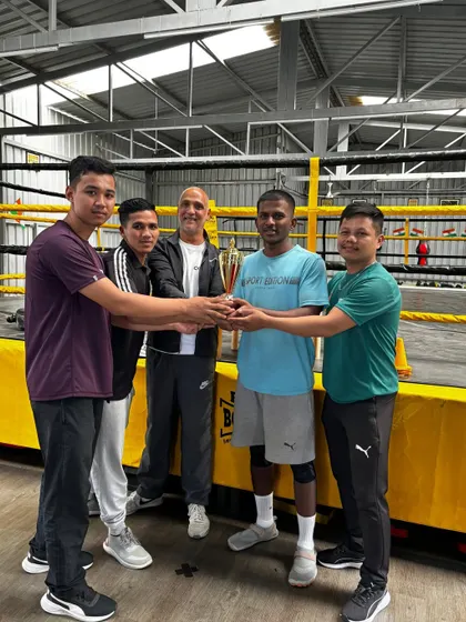 The team celebrating a win at our internal Boxing Fitness Competition. It's about building a competitive and supportive community.