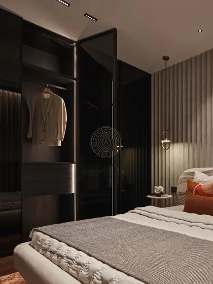 This bedroom features a more muted palette with a sleek, black glass closet that adds a touch of sophistication. The open section reveals a well-lit space for display, showing our attention to both aesthetics and functionality.