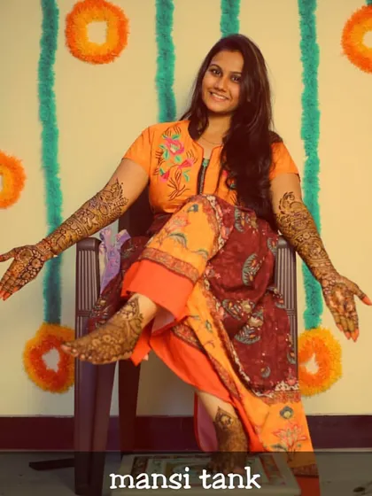 This bride looks so radiant and happy with her complete bridal mehendi. I did intricate designs on both her hands and feet for her special day.