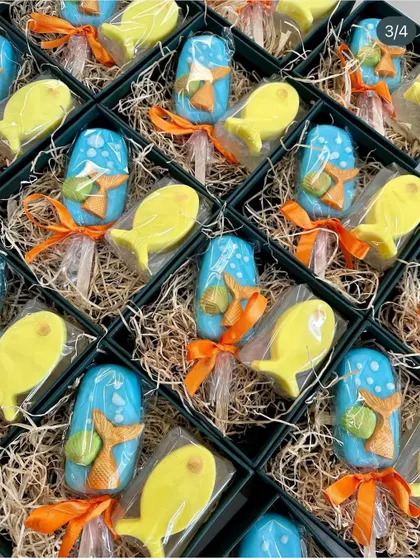 An ocean-themed gift set featuring mermaid tail popsicle soaps and fish-shaped soaps, perfect for an underwater party.