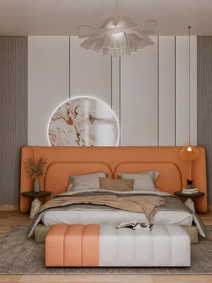 This bedroom project features a vibrant orange theme. The upholstered headboard and matching bench create a bold focal point, while the neutral walls and wooden floors provide balance.
