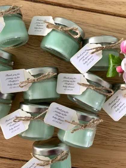 These mint green mini candles with personalized tags are another great example of a budget-friendly baby shower favor.
