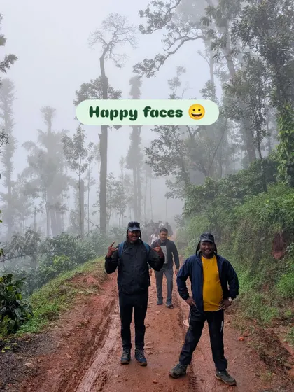"Happy faces" says it all. Two smiling trekkers on a muddy trail.