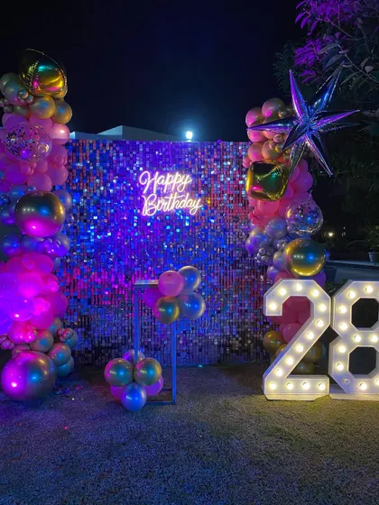 The complete outdoor setup for the 28th birthday, perfect for an evening celebration in a garden or on a terrace.